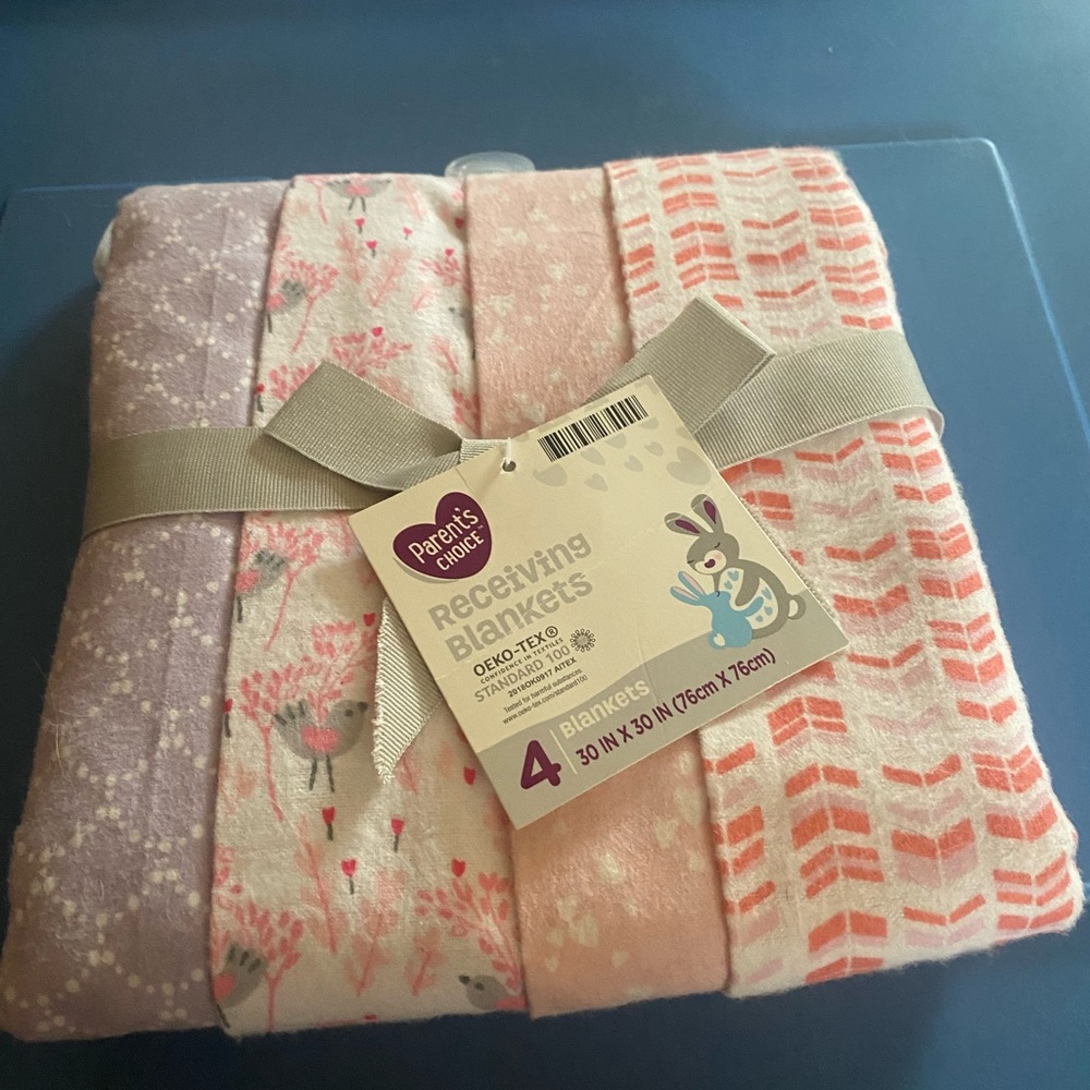 Girl receiving blankets set a four